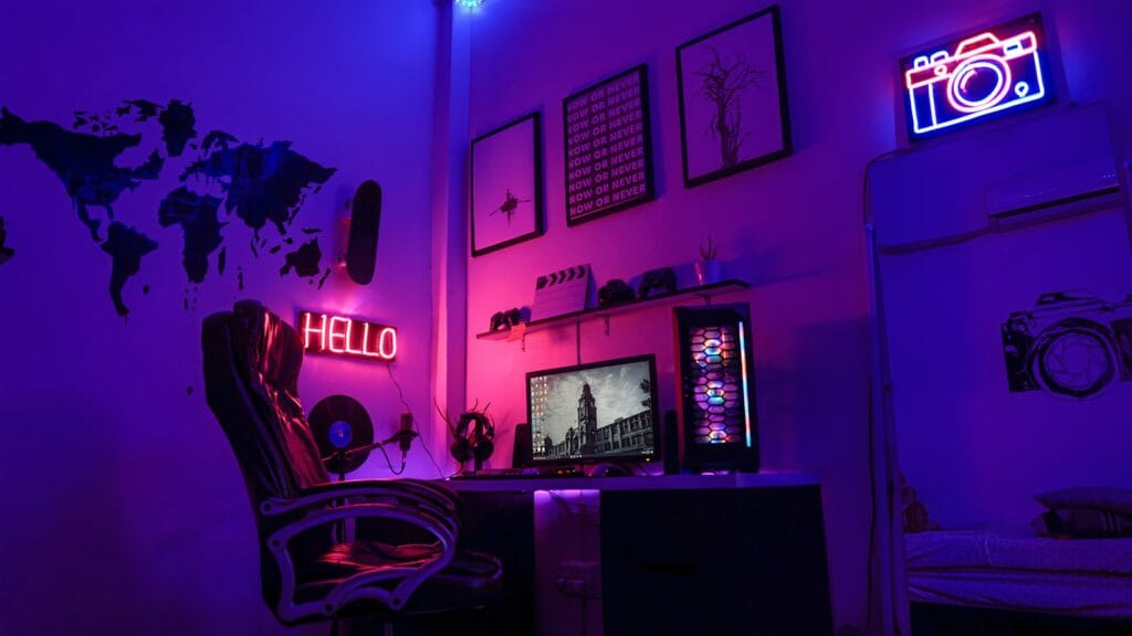 gaming setup: black flat screen tv turned on near white wall
